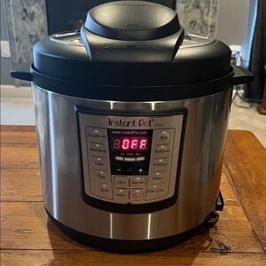 Instant Pot 6 in 1 Programmable Pressure Cooker. In original packaging. New.